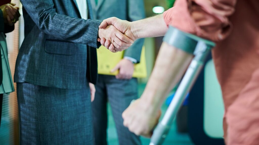 Lawyer shaking hands with injured person