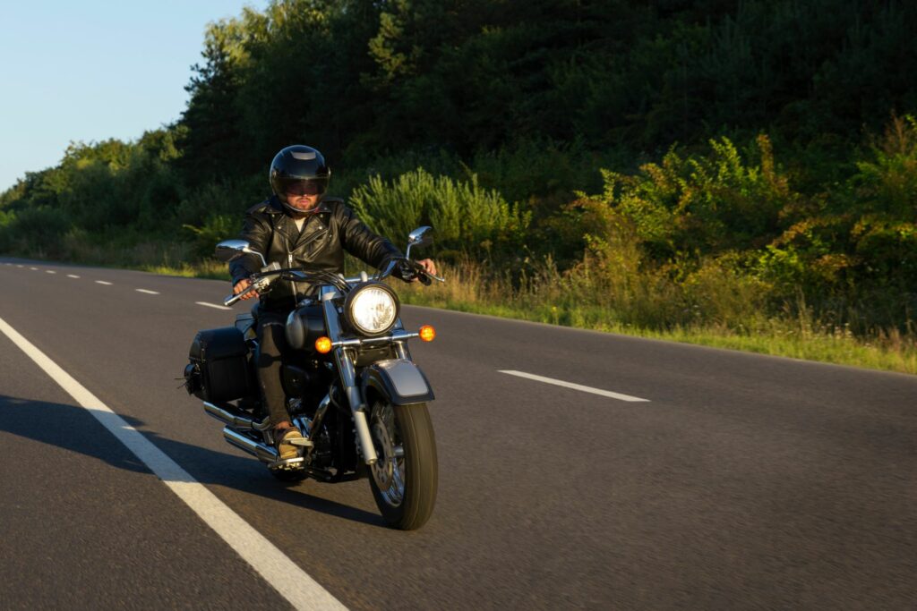 Man riding motorcycle with a helmet on