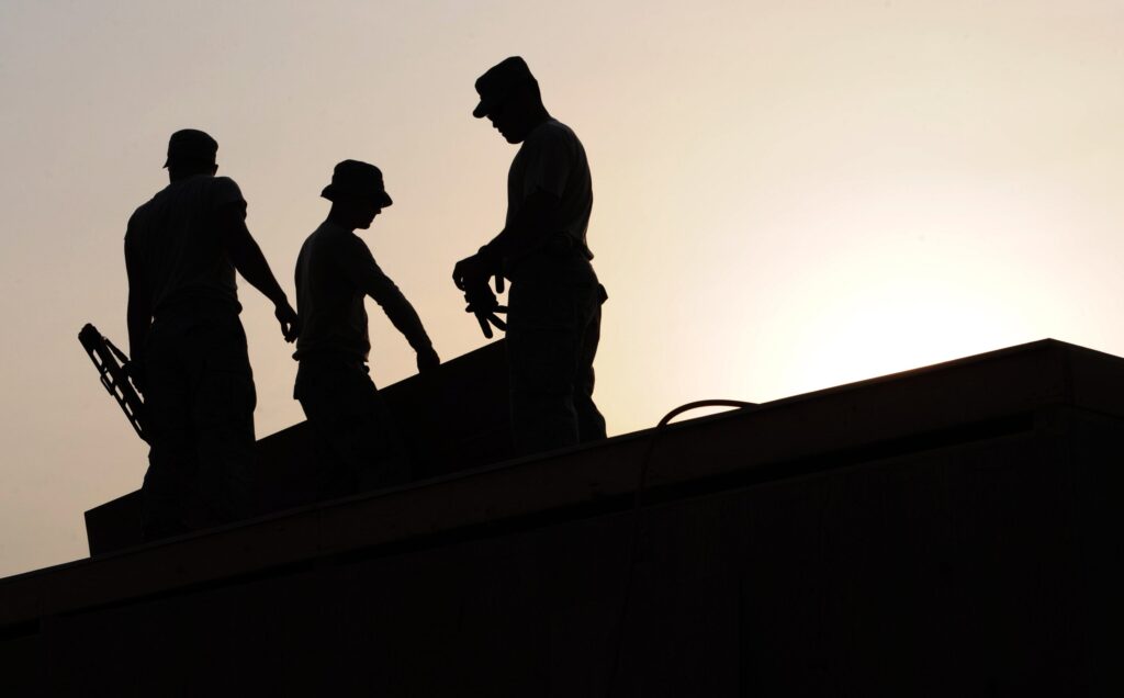 Construction Workers on a roof