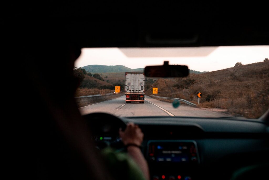 Driver looking through windshield to see a truck in front of them