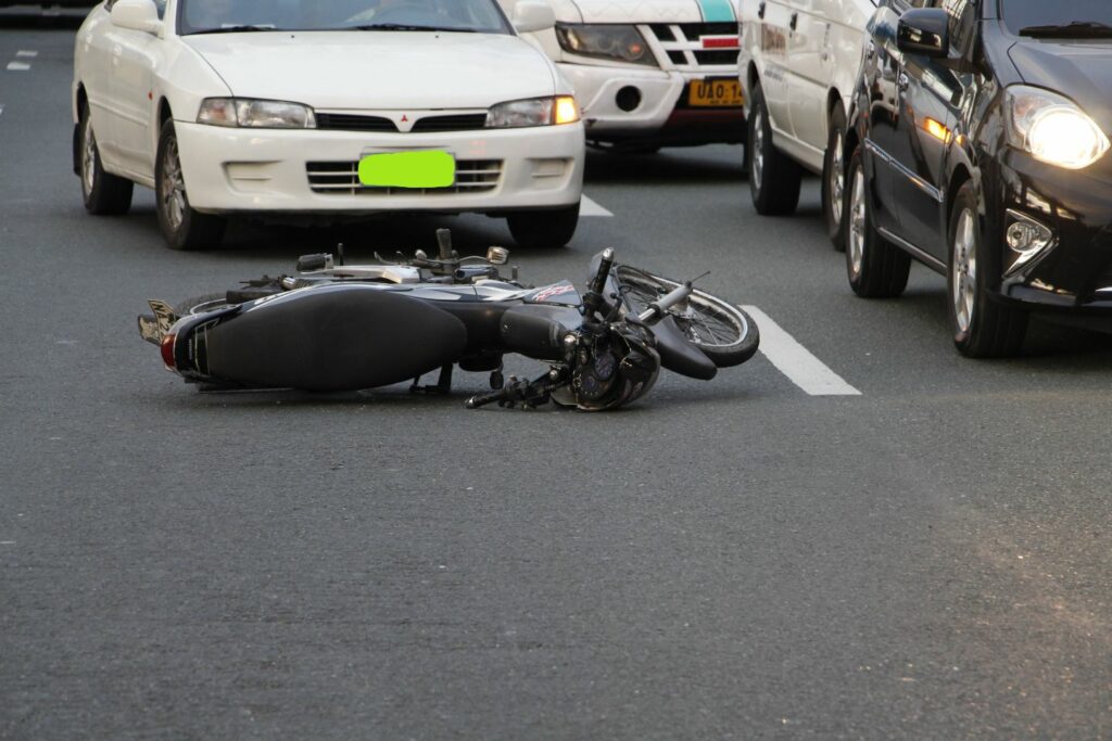 Motorcycle in the middle of road, knocked over